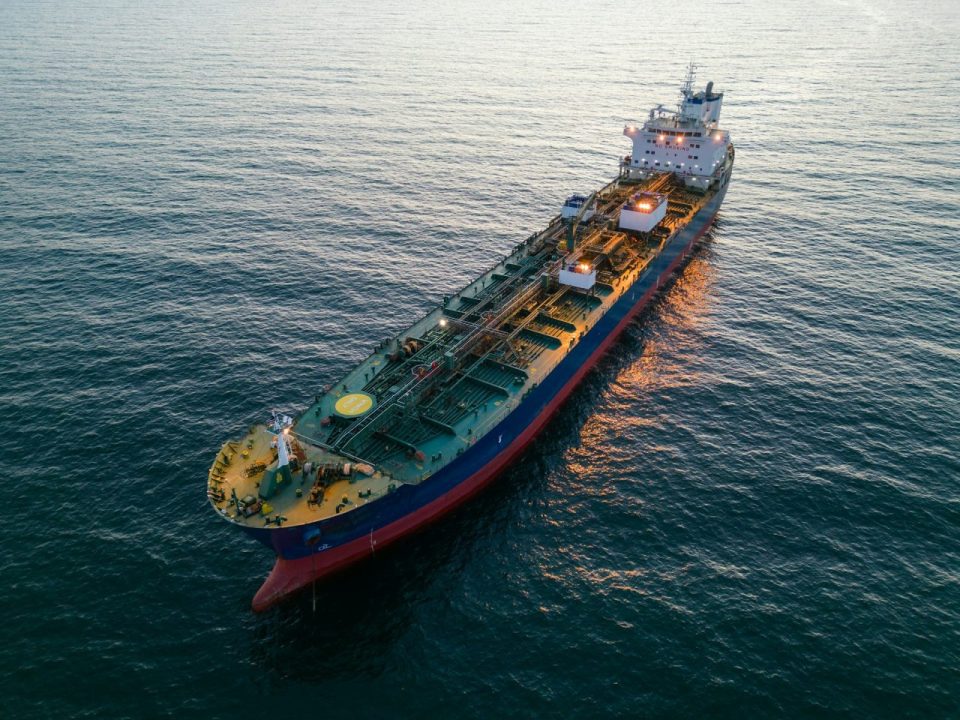 Aerial view oil ship tanker carrier oil on the sea at sunset